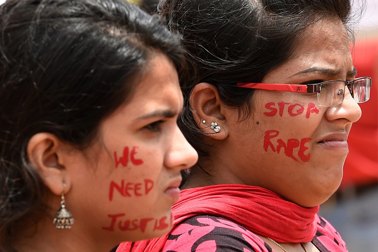 Indian activists participate in a rally organised by "The Red Brigade - Bring Bangalore Back" to protest against the recent incidents of sexual abuse, molestation and rapes against women in Bangalore on July 20, 2014. The protestors demanded police take action against sexual offenders, child sexual abuse and rapists after several cases of sexual violence against women were registered in Bangalore in the last few days. AFP PHOTO/Manjunath Kiran        (Photo credit should read Manjunath Kiran/AFP/Getty Images)